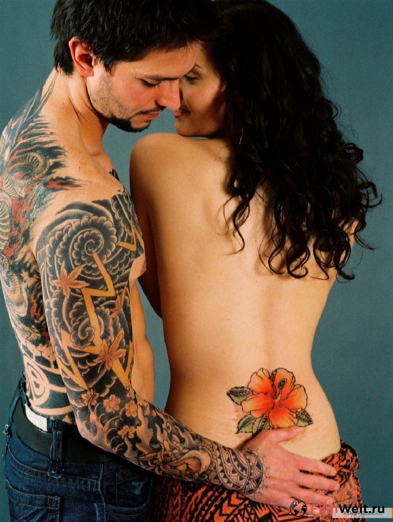 Tattooed couple orgasm